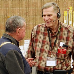 A North Shore Amateur Radio Club member, Ralph (VE3CRK) takes some time from volunteer to catch up and chat with an old friend.
