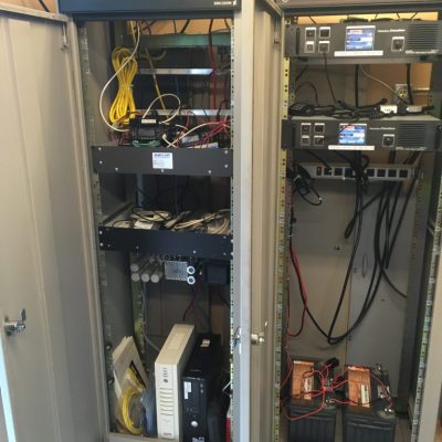 This is the inside of both cabinets. On the left is the cabinet with packet, APRS, DMR, and other technical projects. On the right is our main repeater cabinet with VE3OSH and VE3NAA.